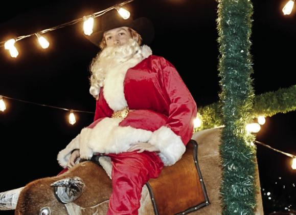 Santa rode a bucking bull on the 11th Street Cowboy Bar's float. The Warrior's Heart Service Dogs came out to the parade. BULLETIN PHOTOS/ Tracy Thayer